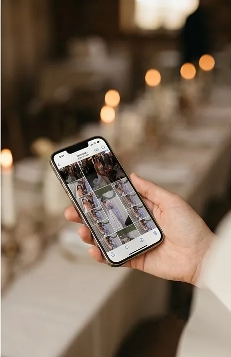 A phone showing a grid of photos collected from the event